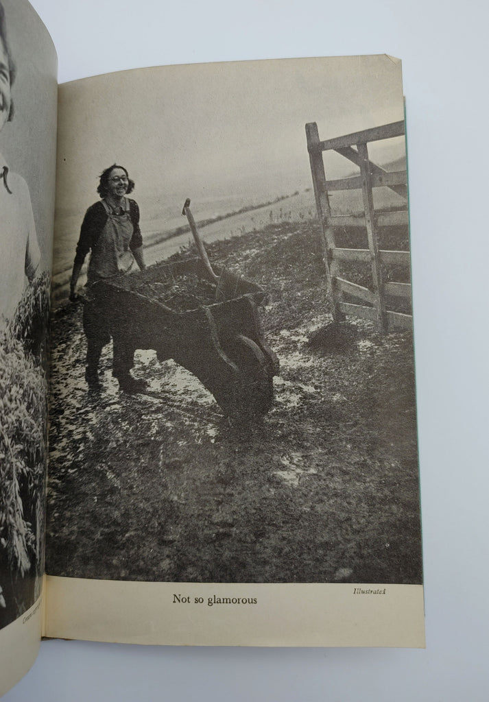 Picture of a woman pushing a wheelbarrow from the first edition of Sackville-West's The Women's Land Army (1944)