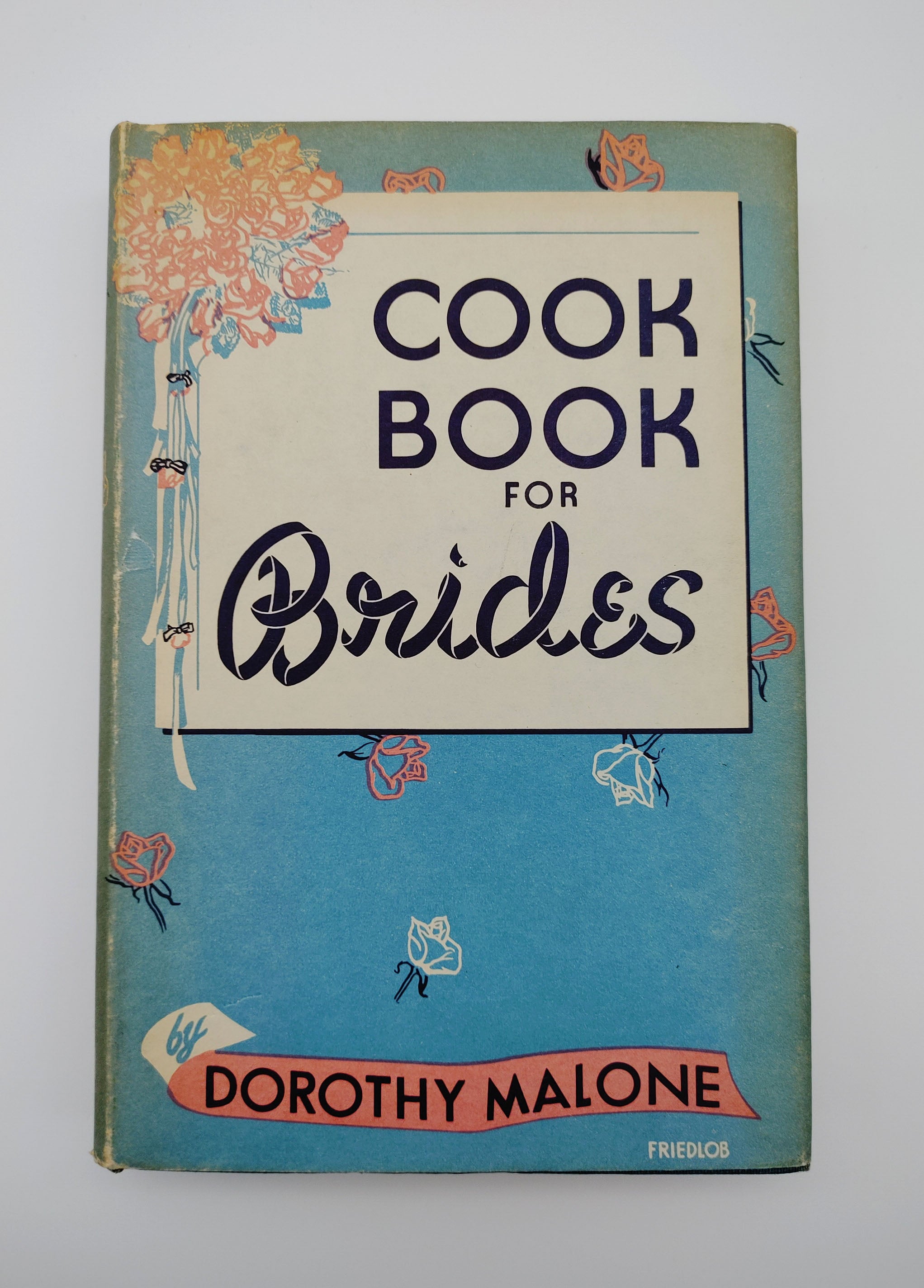 dust jacket of the first edition of Malone's Cook Book for Brides (1947)