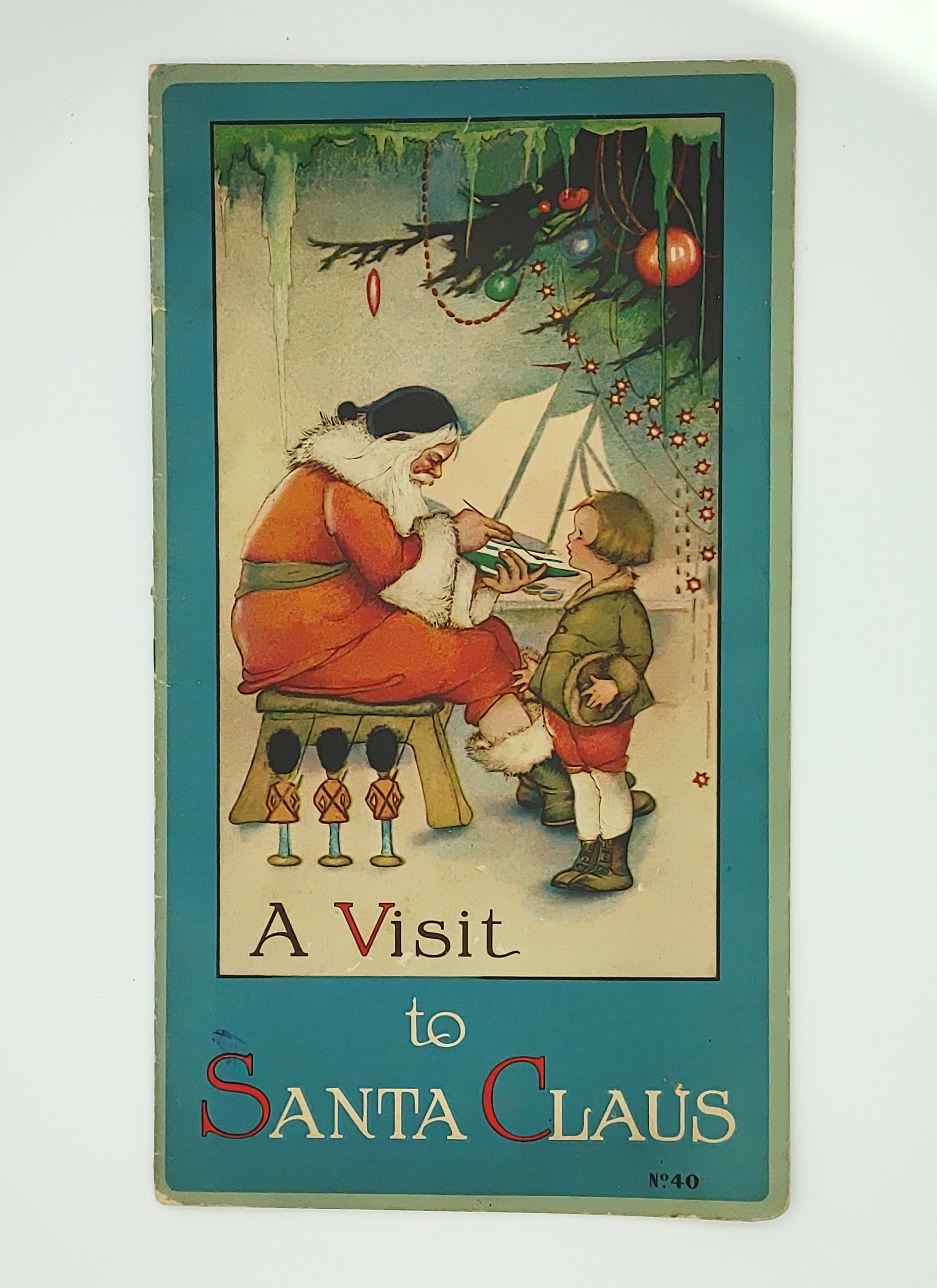 First edition of Margaret Evans Price's A Visit to Santa Claus, with cover featuring an image of Santa painting a plane for Teddy Malleen