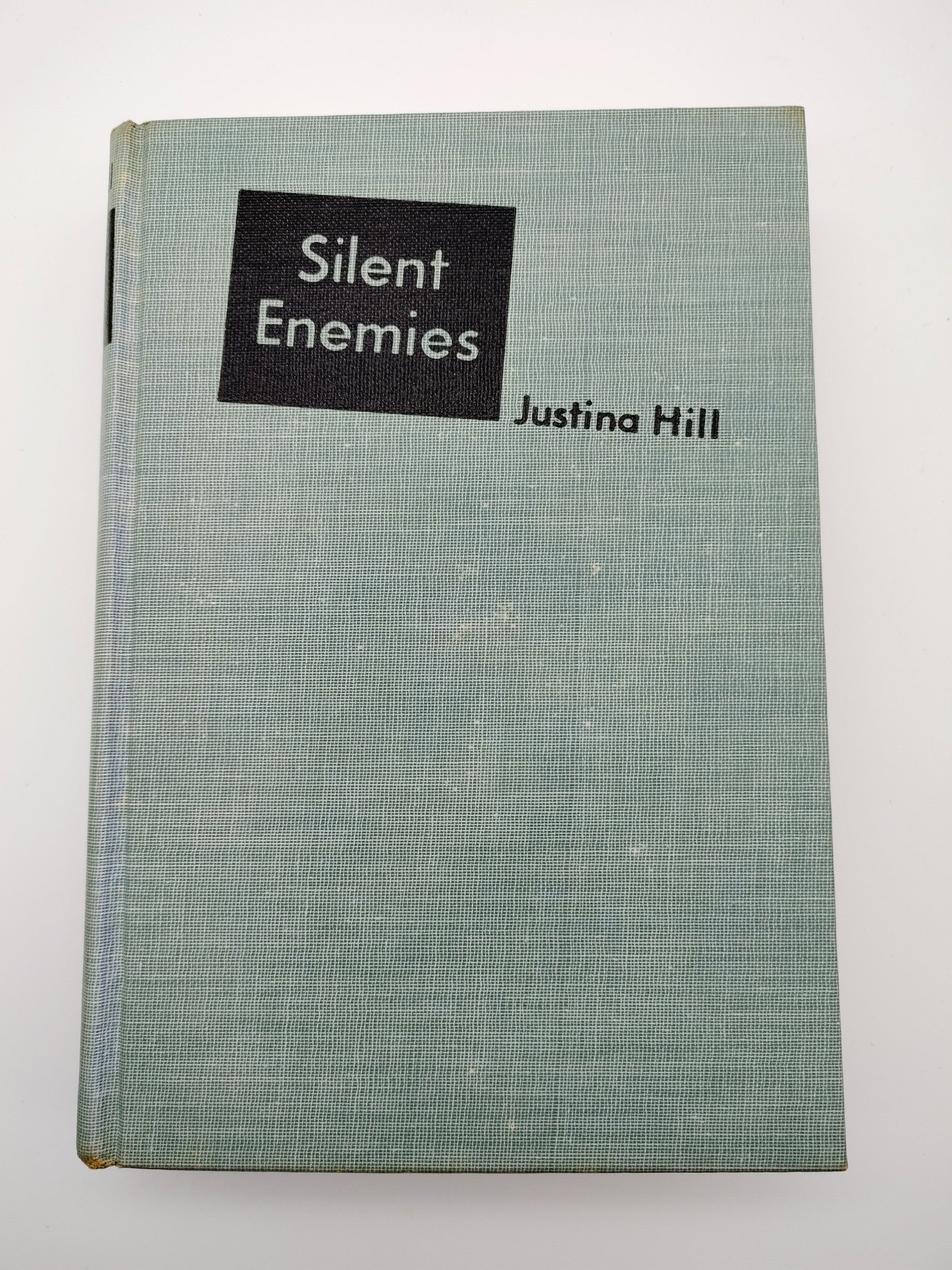 Book without jacket of the first edition of Hill's Silent Enemies (1942)