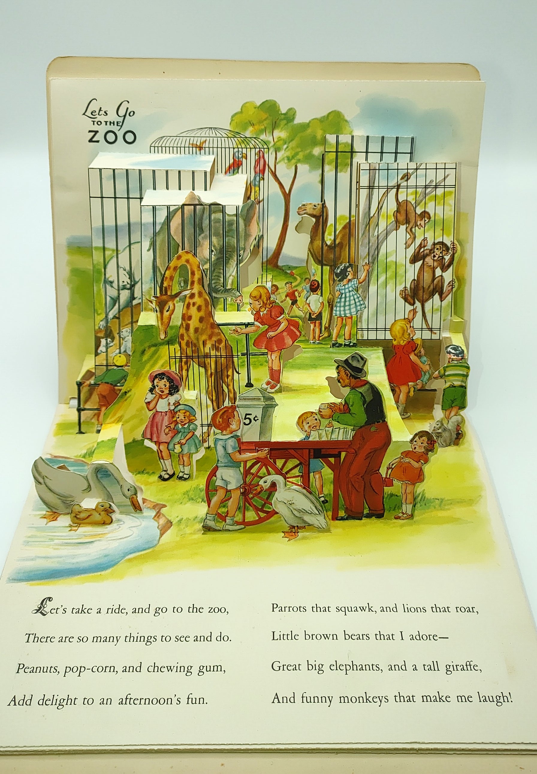 Pop-up of children at the zoo from Play Time In Action (1949)