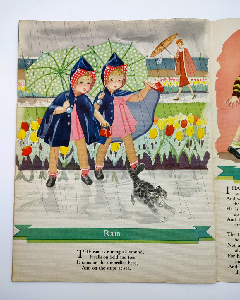 Page from A Child's Garden of Verses featuring the poem, "Rain," with a George Trimmer illustration of two girls in raincoats holding umbrellas