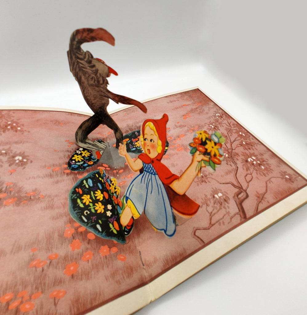 Pop-up illustration of Little Red Riding Hood and the wolf from Blue Ribbon's Little Red Ridinghood (1934)
