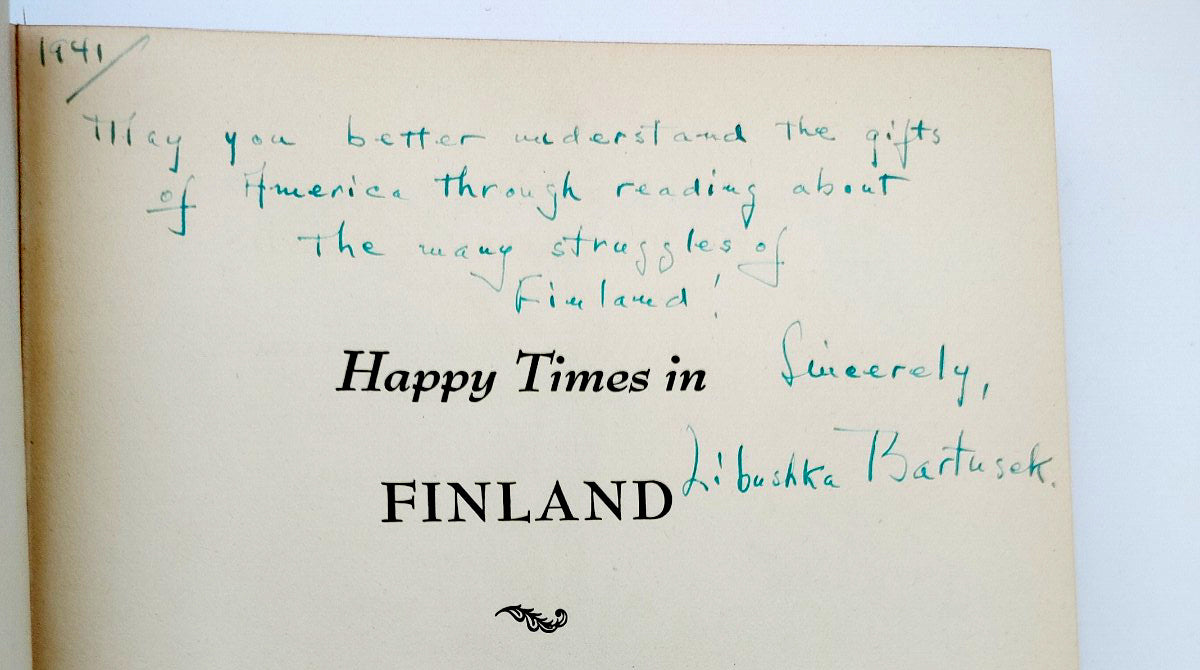 Inscription with signature on the title page of the first edition of Libushka Bartusek's Happy Times in Finland (1941)