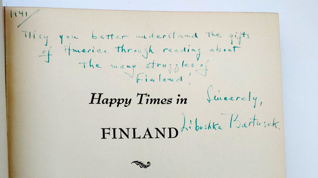 Inscription with signature on the title page of the first edition of Libushka Bartusek's Happy Times in Finland (1941)