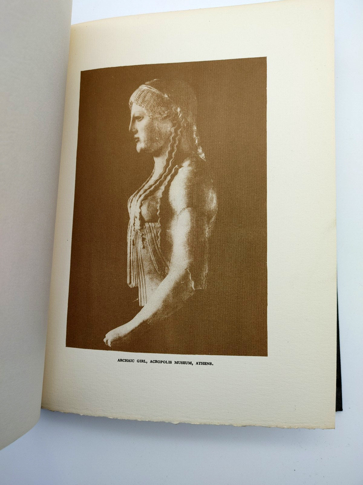 Photographic illustration of a statue at the Acropolis Museum from Bennett Arnold's Mediterranean Scenes (1928)